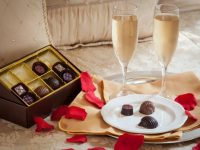 Rose petals, chocolates, and sparkling wine at our Maine B&B