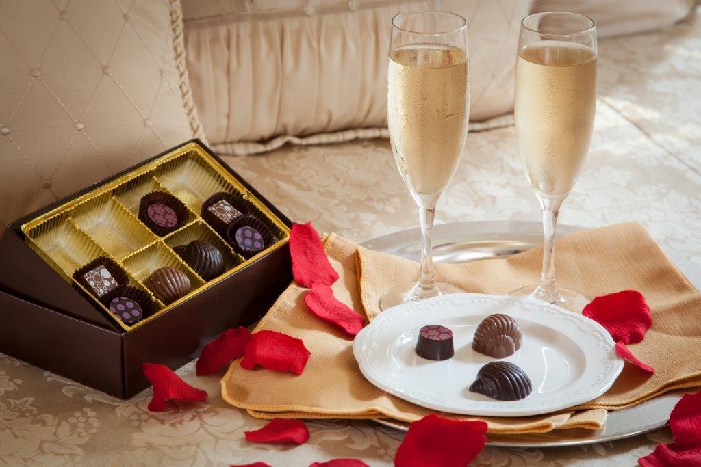 Rose petals, chocolates, and sparkling wine at our Maine B&B