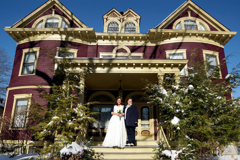 Same sex couple getting married in the winter in Maine when they elope to Berry Manor Inn