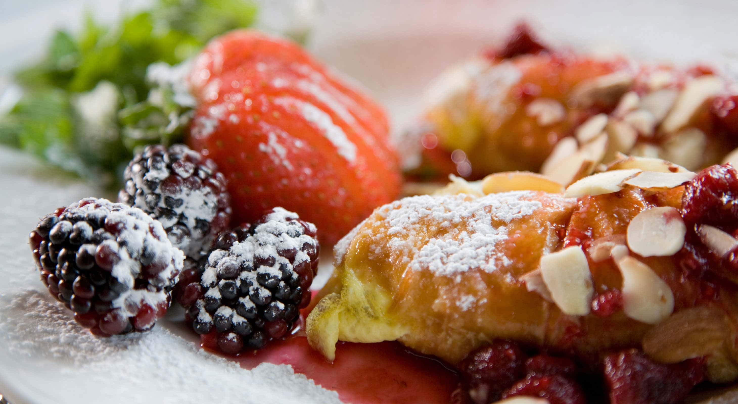 Breakfast dish close-up of a pastry and fruit