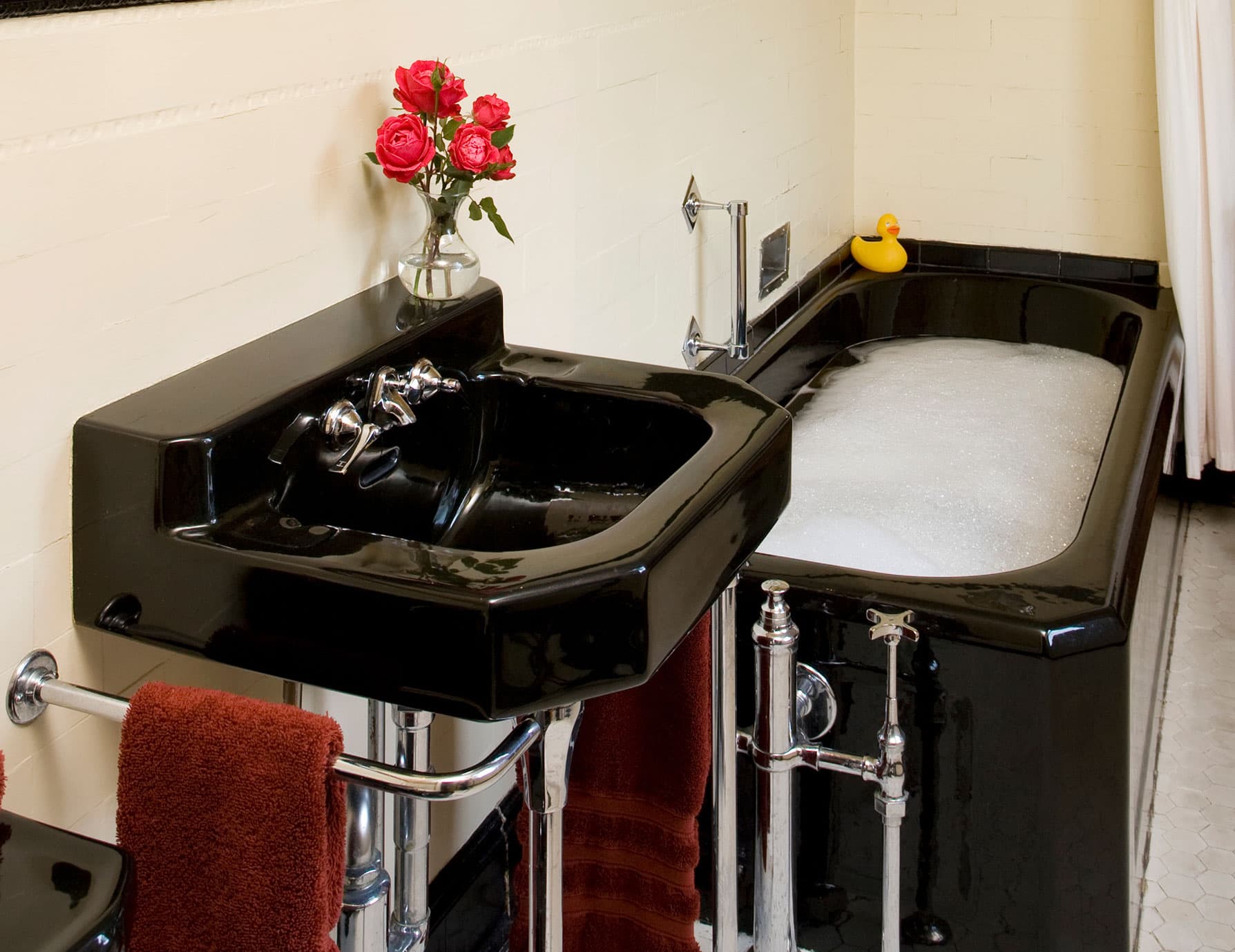 Immaculate bathroom with tub full of warm water