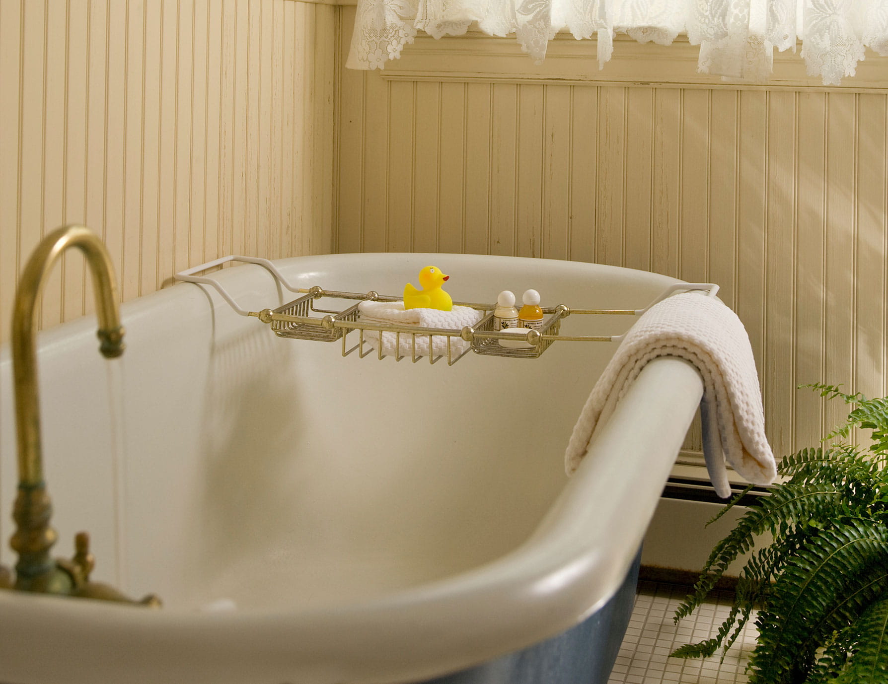 Warm bathtub with small supplies tray