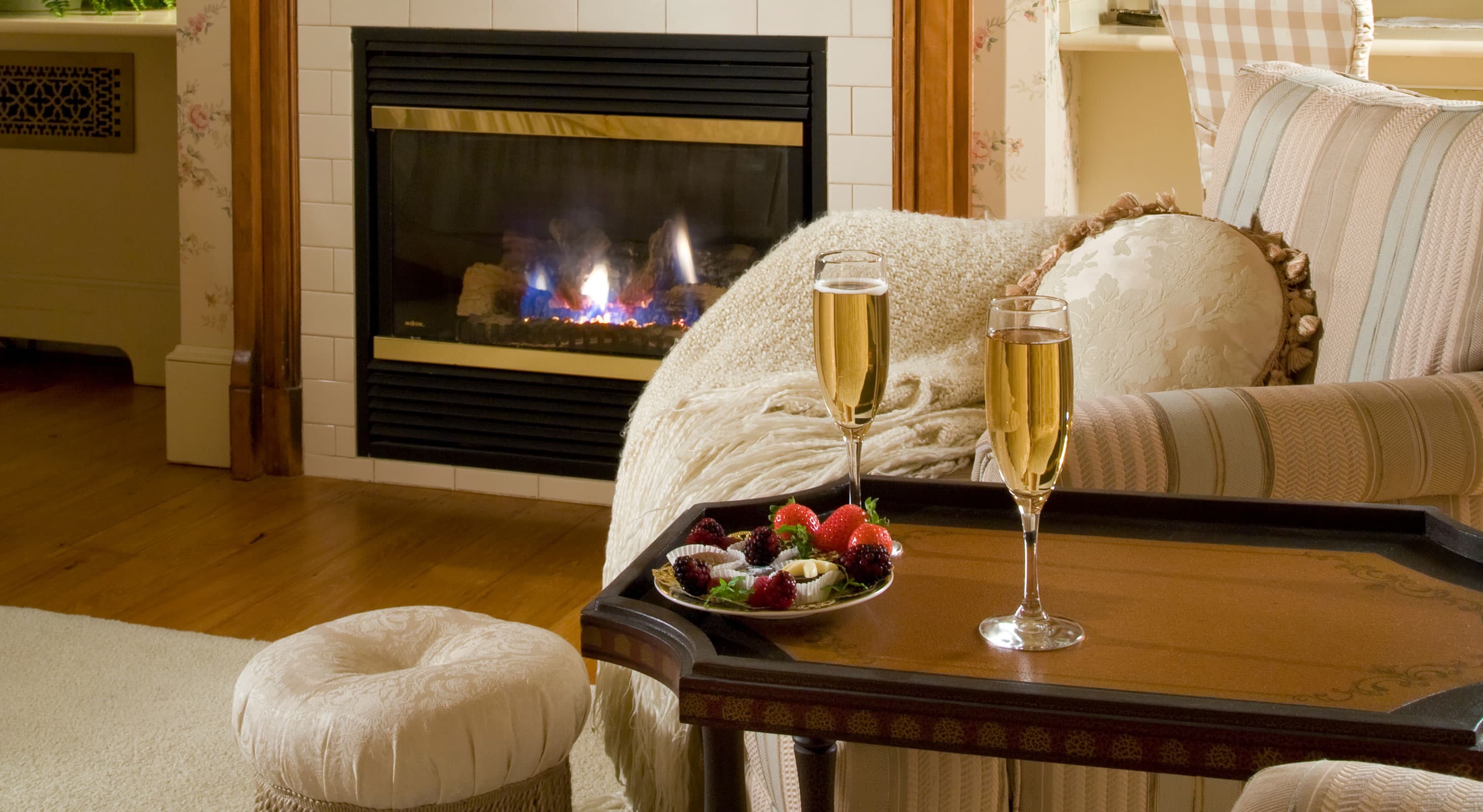 Champagne for two with chocolate strawberries in front of the fireplace in Room 3 at our bed and breakfast near Camden