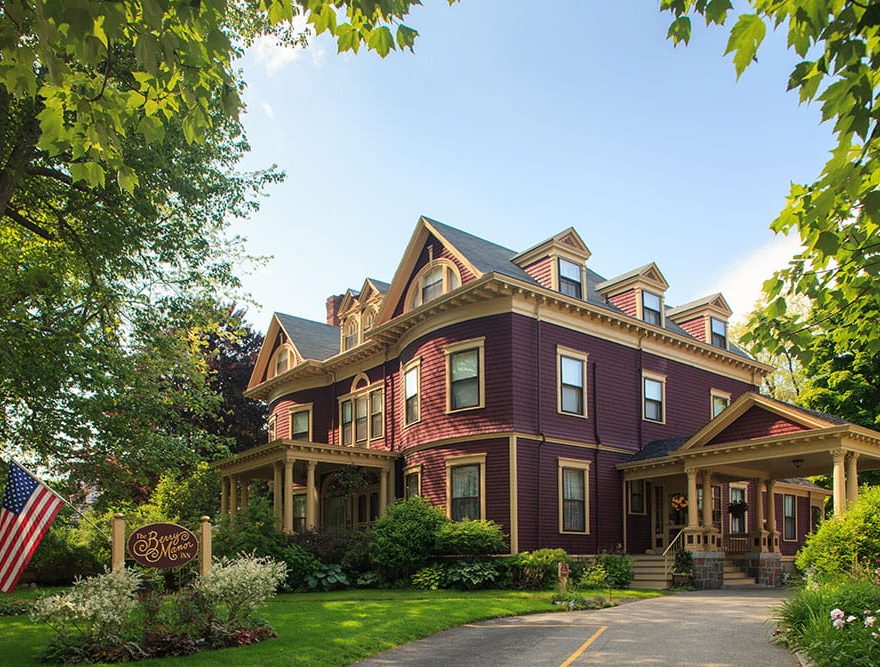 Exterior of the Berry Manor Inn amidst leaves