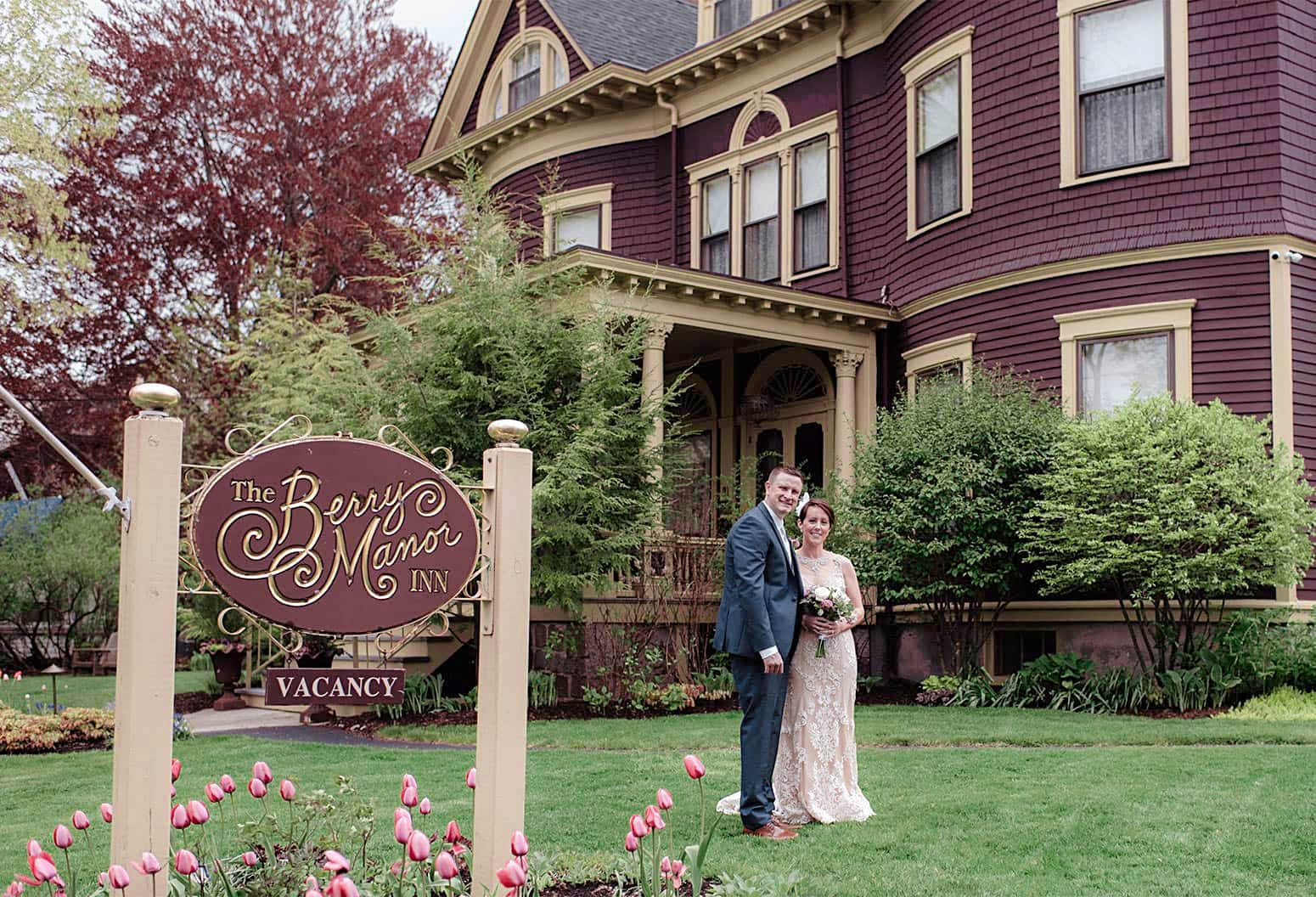 Bride and Groom in Lawn in front of Berry Manor Inn