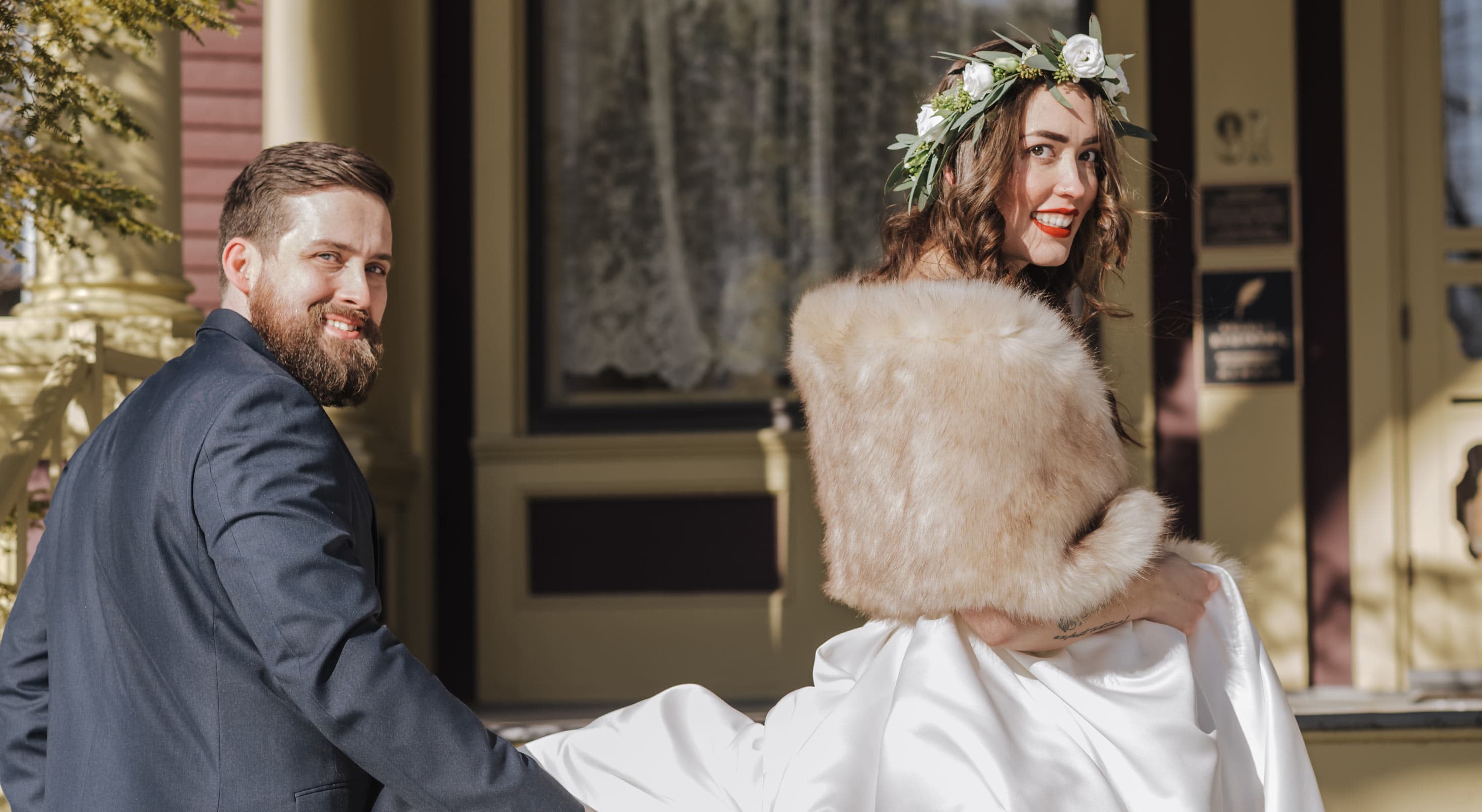 Bride and Groom on the steps of Berry Manor Inn in Winter
