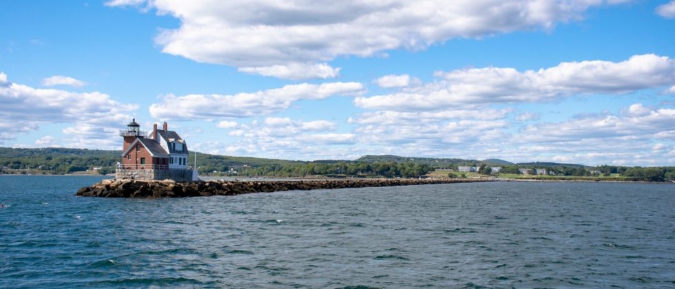 Breakwater Lighthouse on the tip of a narrow peninsula in Penobsoct Bay in Rockland Maine