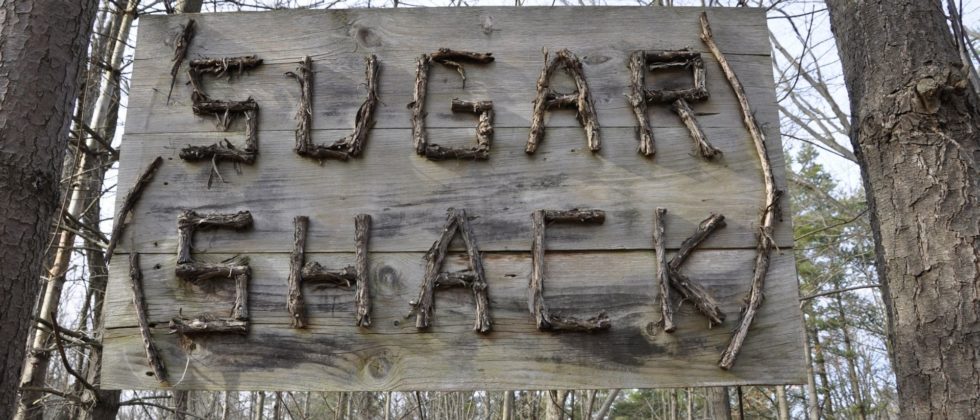 Sugar shack sign made of wood and sticks