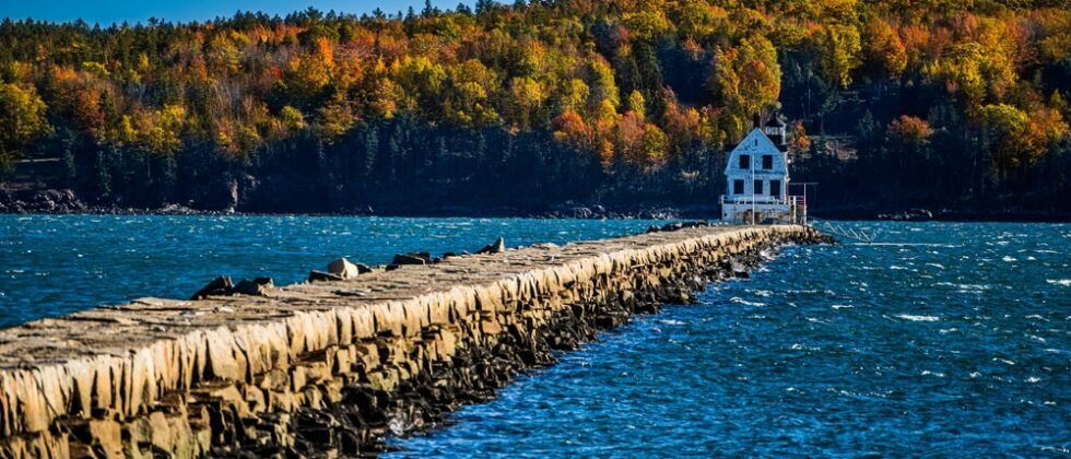 Rockland, Maine in the fall; Breakwater Lighthouse with fall foliage
