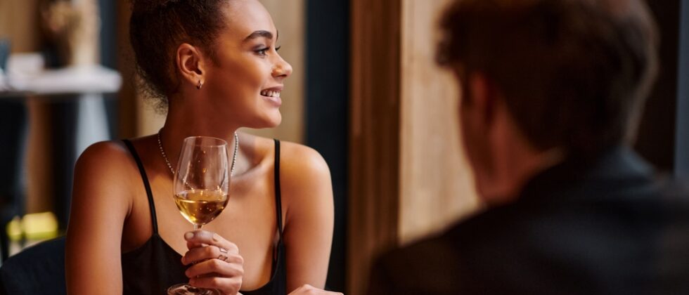 Dine at Primo Restaurant in Rockland, Maine for one of the best meals of your life. Couple enjoying a glass of wine with dinner.